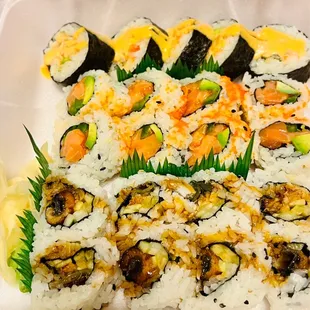 a close up of a tray of sushi