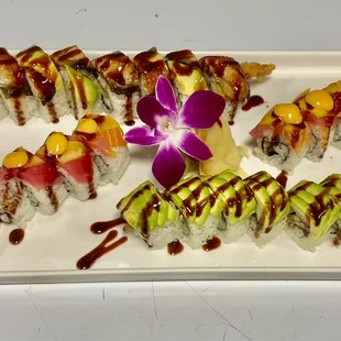 a plate of sushi with a flower