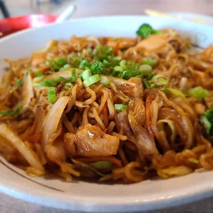 a bowl of noodles and broccoli
