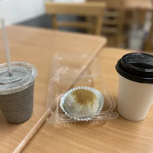 two cups of coffee and a donut