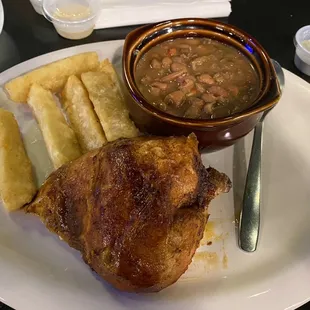 1/4 dark meat chicken with pinto beans and yuca