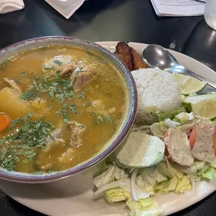 Sopa de Pollo, plantains, rice, side salad.