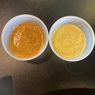 Red spicy sauce that was freezing cold and yellow mild sauce