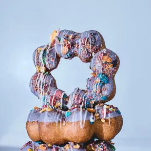 a stack of donuts with sprinkles