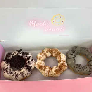 three donuts in a box