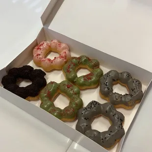 Strawberry, Matcha, Chocolate Oreo, and Black Sesame mochi donuts.