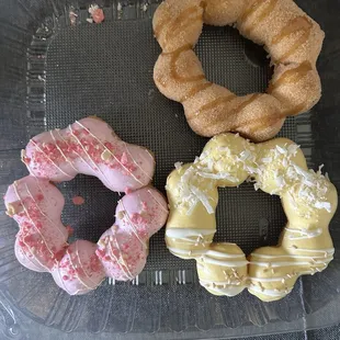Strawberry shortcake, cinnamon churro, and mango coconut donuts