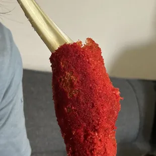 Mozzarella corn dog with hot Cheeto topping