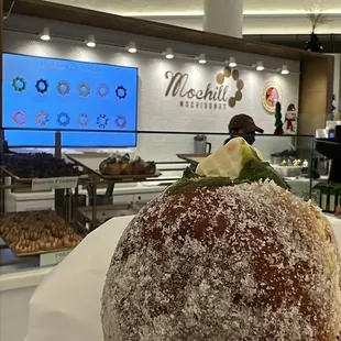 a person holding a donut