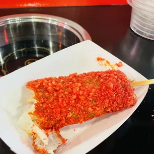 Flaming hot Cheetos rice dog