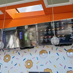 a variety of tvs mounted on the wall