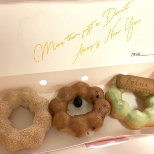 three donuts in a box