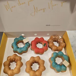 a dozen donuts in a box