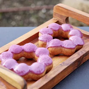 a tray of doughnuts on a table