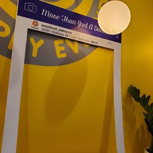 Wall with a social media cut out in the lobby area