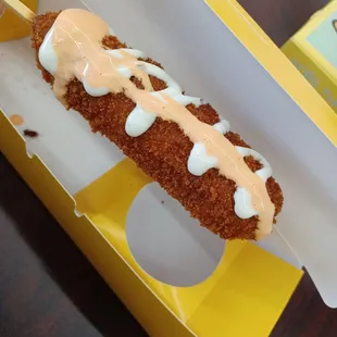 An original rice dog (can choose different toppings). I put rice and spicy mayo on top!