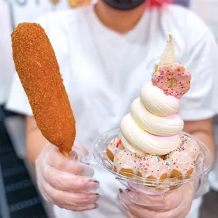 a person wearing a face mask and holding a plate of food