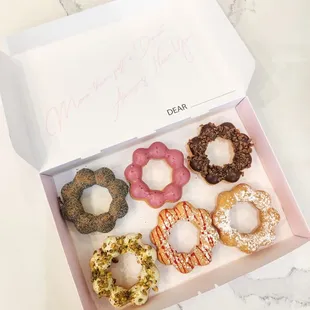 a dozen donuts in a box