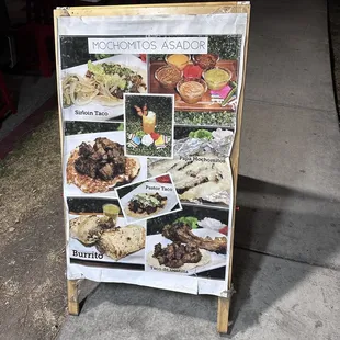 a sign on a sidewalk