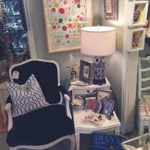 Antique white wooden French chair Upolsterer in a deep dark blue velvet . With side table and a rare blue willow lamp.