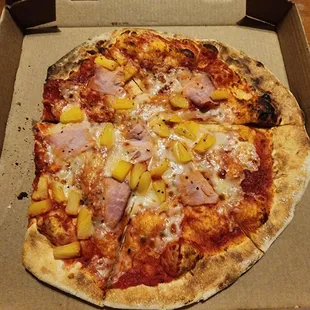 Just got home and a section of my pizza is missing.  This is one sorry looking pizza.  Why would they let this go out the door.