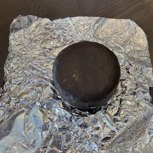 a chocolate cake on tin foil