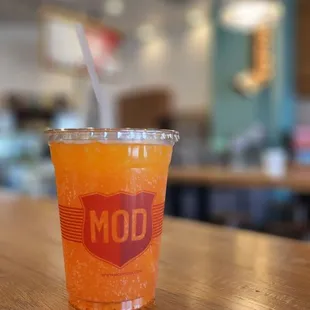 a cup of soda on a table