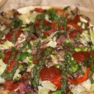 a pizza with vegetables on it
