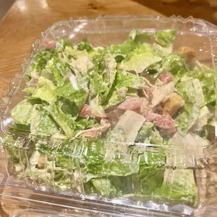 Caesar Salad with chicken - tossed.