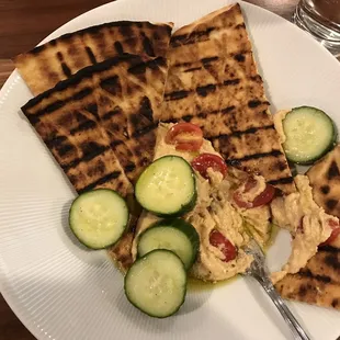 Partly eaten hummus plate