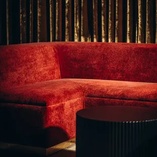 a red couch and coffee table