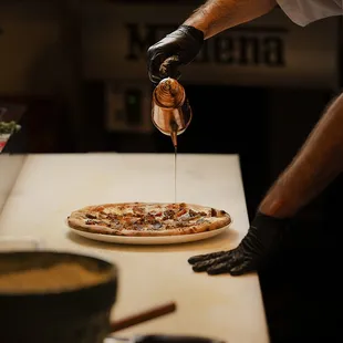 Pizzaiolo making a delicious pizza