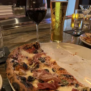 Quatrovolve pizza, Peroni beer, Contessa d&apos;Abruzzo Montepulciano wine.