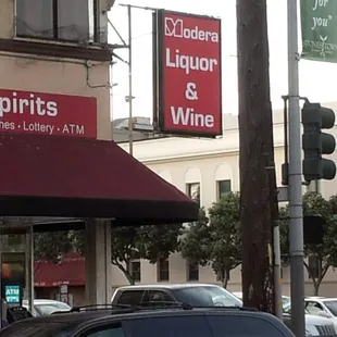a car parked in front of a liquor store