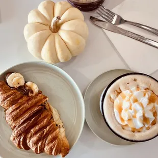 a croissant and a cup of coffee