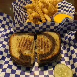 a grilled cheese sandwich and french fries