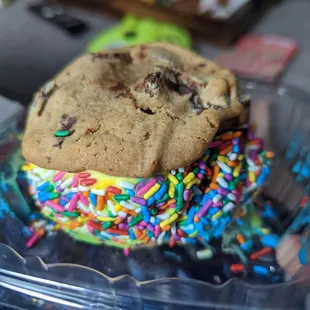 a chocolate chip cookie with sprinkles