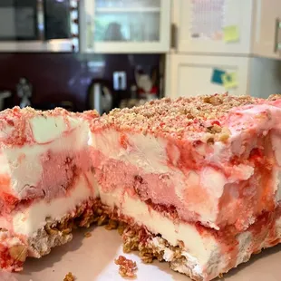 Strawberry praline cake (?) square (?) sold in their freezer for $6- get this!!!!