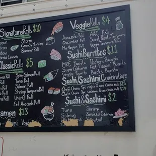 a menu on the side of a food truck