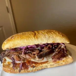 a beef sandwich on a plate