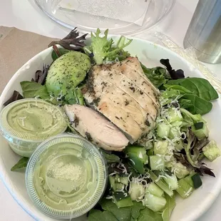 Build your own salad with mixed green, cucumbers, grilled chicken, shaved parm cheese, an avocado and basil buttermilk dressing
