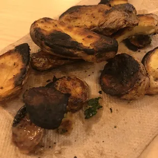 Burnt potatoes, black burnt dust on finger.