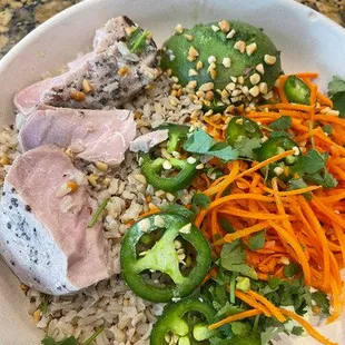 This tuna bowl is missing BOTH sauces and just look at how overcooked the tuna is - YUCK!