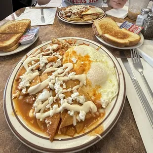 Chilaquiles with Hash browns, eggs, 4 slices of sourdough bread