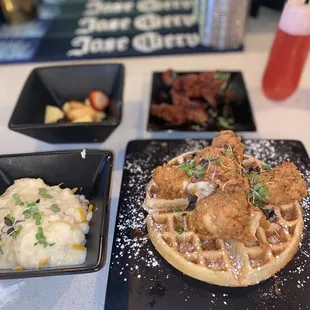 Chicken and waffles , bacon , cheese grits