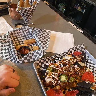 Pickle fries, cheese planks and brisket nachos.