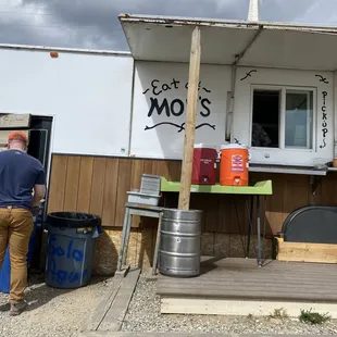 a man standing in front of a food truck