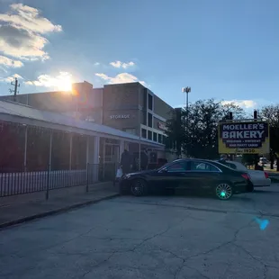 a car parked in front of a restaurant