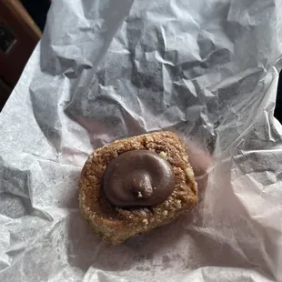 I have no clue but tasted like a nut based cookie with a like nutmeg sorta chocolate topping. I loved it and have no clue what it was!