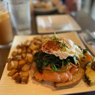 My "go to": Salmon Benedict with side country potatoes and plantation iced tea (sriracha on side)